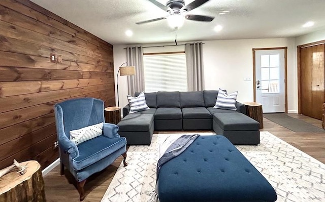 20786 Heritage Ln, Marshall, IL 62441 - living area with wooden walls, ceiling fan, baseboards, and wood finished floors