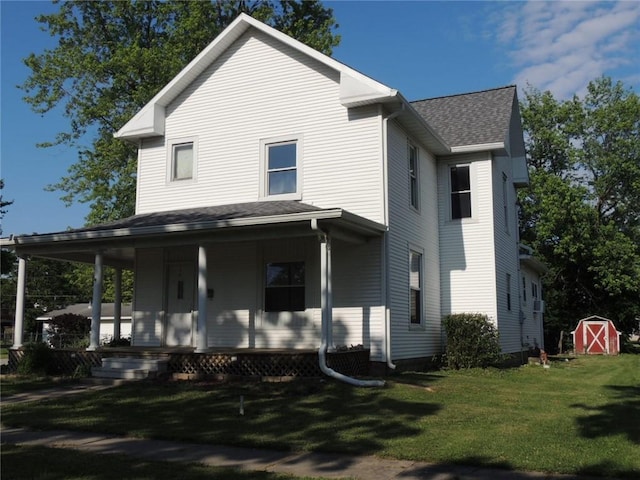 401 3rd St, Altamont, IL 62411 - rear view of property featuring a porch, a lawn, and a shingled roof