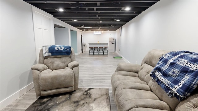 living room with wood finished floors and baseboards