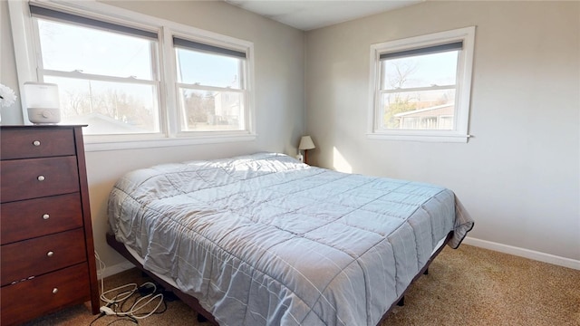 bedroom with carpet and baseboards