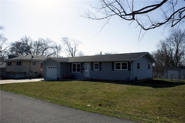 ranch-style house with a front lawn, concrete driveway, and a garage