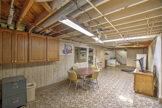 3204 Meadow Ln, Decatur, IL 62521 - below grade area featuring wooden walls, tile patterned floors, and stairs