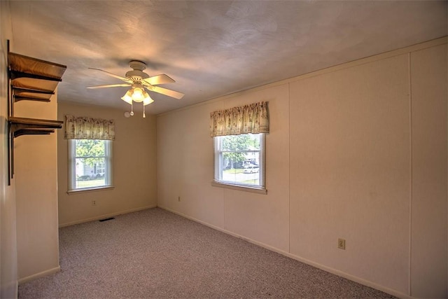 3204 Meadow Ln, Decatur, IL 62521 - empty room featuring carpet floors and a ceiling fan