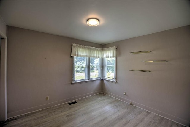 3204 Meadow Ln, Decatur, IL 62521 - empty room with baseboards and light wood finished floors