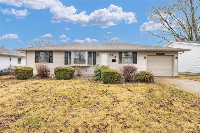 ranch-style home with concrete driveway, a front lawn, and an attached garage