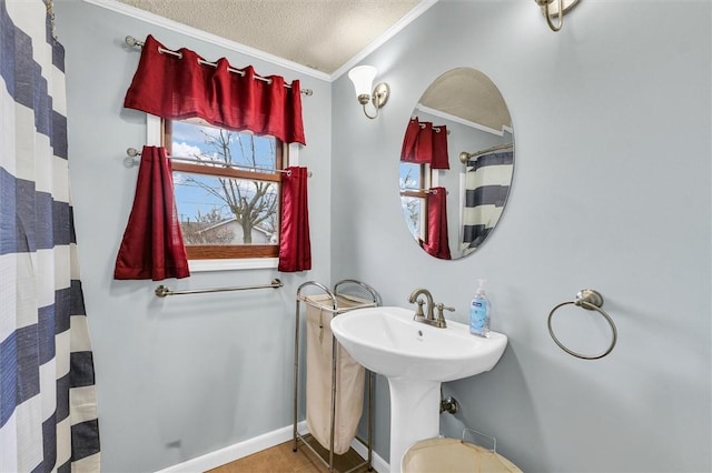 full bathroom with ornamental molding, a textured ceiling, a shower with curtain, baseboards, and tile patterned floors