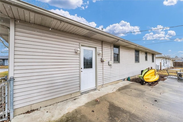 back of house with fence and a patio