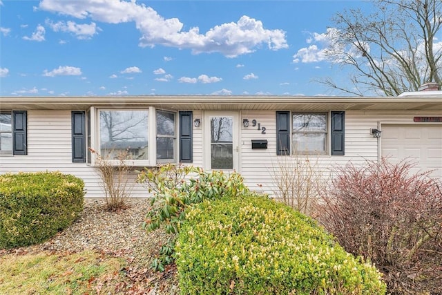 single story home featuring an attached garage