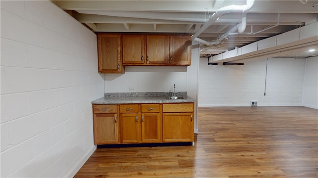 kitchen with sink and light hardwood / wood-style floors