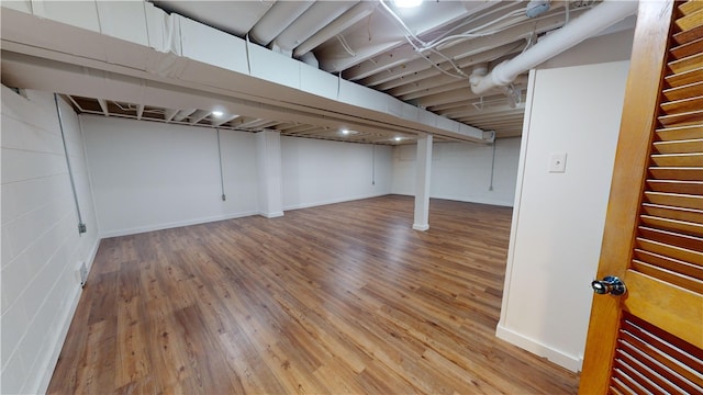 basement featuring light hardwood / wood-style flooring