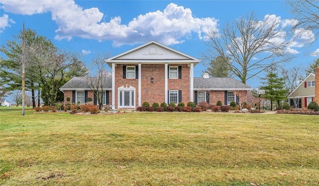 greek revival house with a front lawn