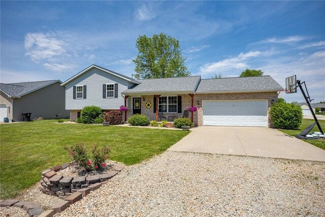 9234 E Topaz St, Effingham, IL 62401 - tri-level home featuring driveway, a garage, a front lawn, and brick siding