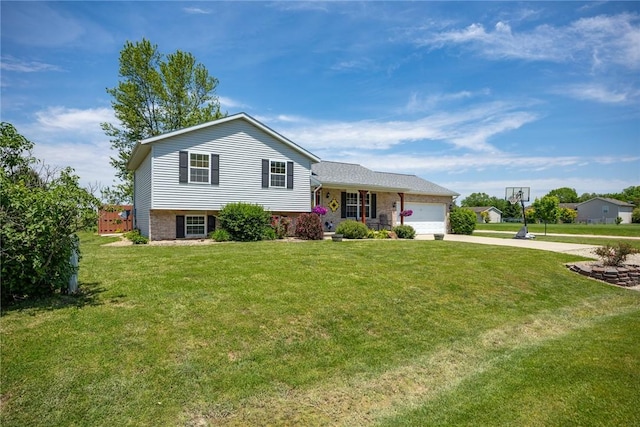 9234 E Topaz St, Effingham, IL 62401 - tri-level home with concrete driveway, a garage, and a front lawn
