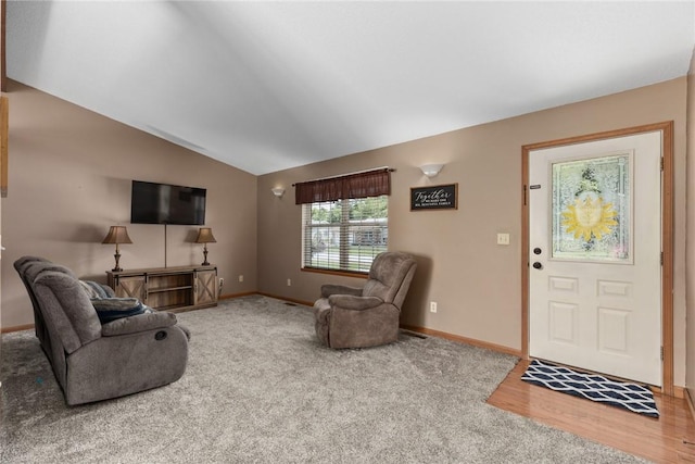 9234 E Topaz St, Effingham, IL 62401 - carpeted living area featuring lofted ceiling, baseboards, and wood finished floors