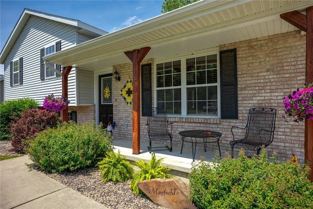 9234 E Topaz St, Effingham, IL 62401 - doorway to property with covered porch and brick siding