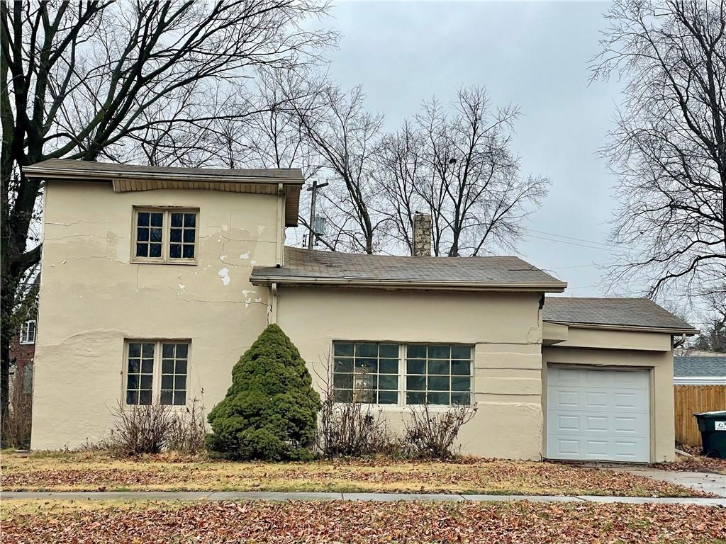 view of side of property featuring a garage