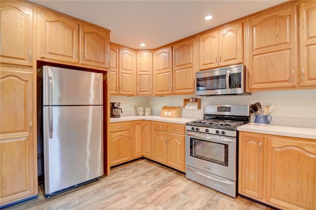 9234 E Cabin Rd, Oakley, IL 62501 - kitchen with stainless steel appliances, light brown cabinetry, and light countertops