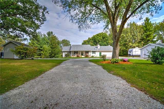 9234 E Cabin Rd, Oakley, IL 62501 - ranch-style home featuring a front yard and driveway