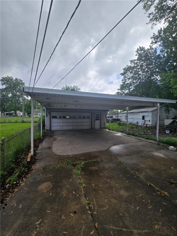 1809 E Decatur St, Decatur, IL 62521 - view of parking featuring fence and a garage