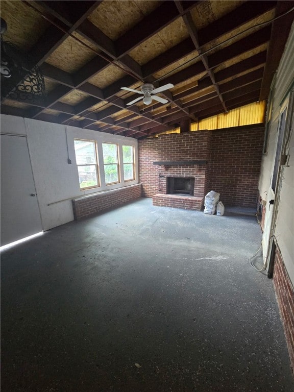 1809 E Decatur St, Decatur, IL 62521 - unfurnished living room featuring a fireplace and a ceiling fan