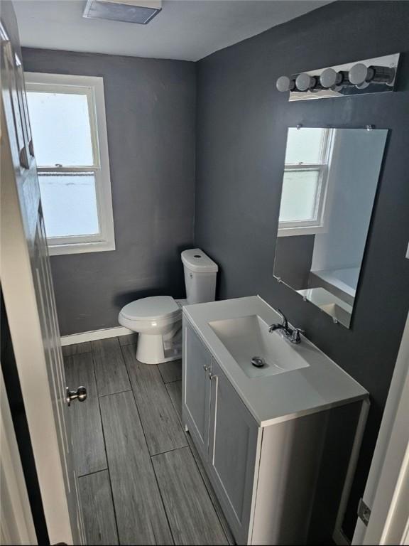 1809 E Decatur St, Decatur, IL 62521 - bathroom featuring toilet, vanity, plenty of natural light, and baseboards