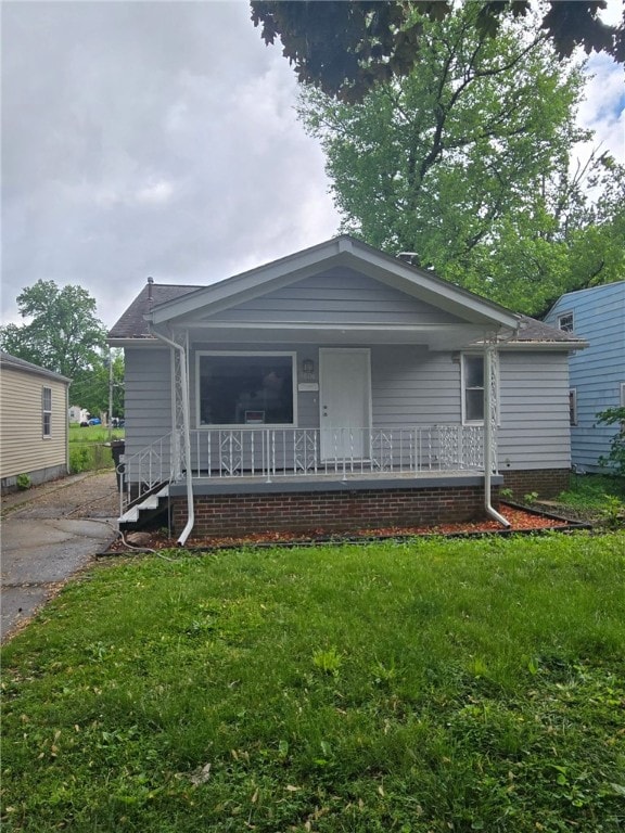 1809 E Decatur St, Decatur, IL 62521 - view of front of home with covered porch and a front yard