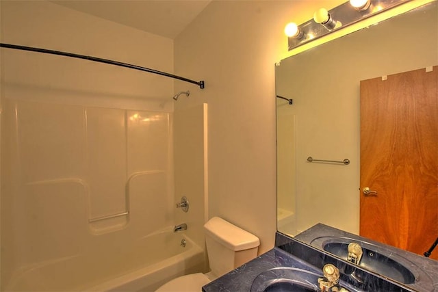 full bathroom with vanity, shower / bathtub combination, and toilet