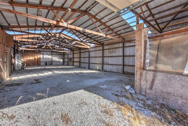 miscellaneous room featuring high vaulted ceiling