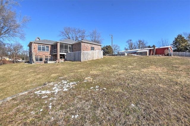 view of yard featuring a sunroom