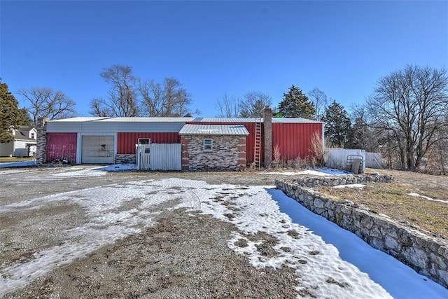 view of snow covered garage