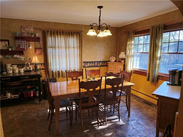 1622 S Cross St, Robinson, IL 62454 - dining room with a chandelier, dark stone finish floors, and ornamental molding