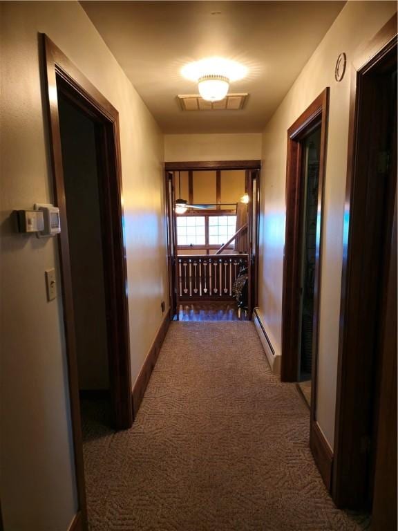 1622 S Cross St, Robinson, IL 62454 - hall featuring a baseboard heating unit, carpet floors, and baseboards