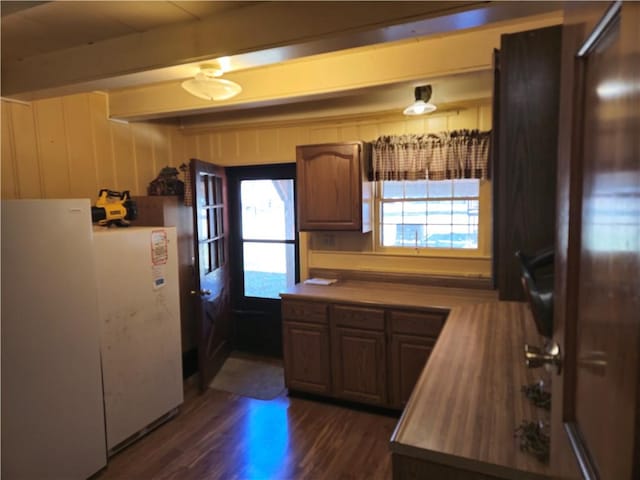 1622 S Cross St, Robinson, IL 62454 - kitchen with dark wood-style floors, beam ceiling, and freestanding refrigerator