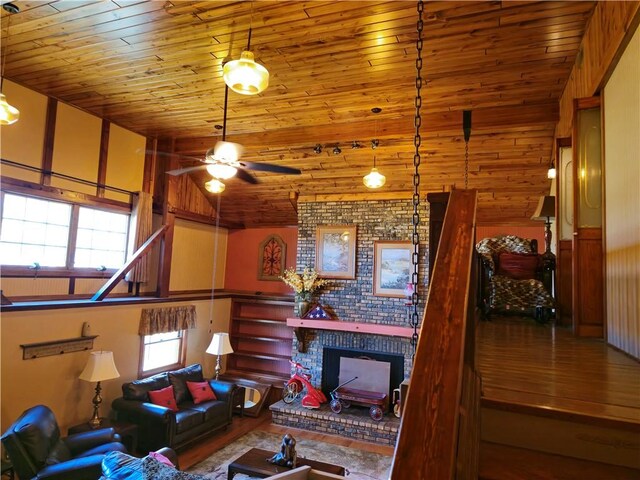 1622 S Cross St, Robinson, IL 62454 - living room with wood ceiling, ceiling fan, a brick fireplace, and wood finished floors