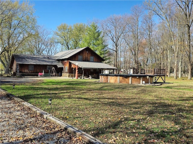 1622 S Cross St, Robinson, IL 62454 - back of house featuring a covered pool and a yard