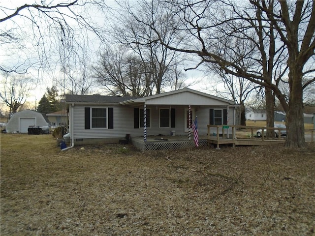 view of front of house featuring a porch, crawl space, an outdoor structure, and a garage