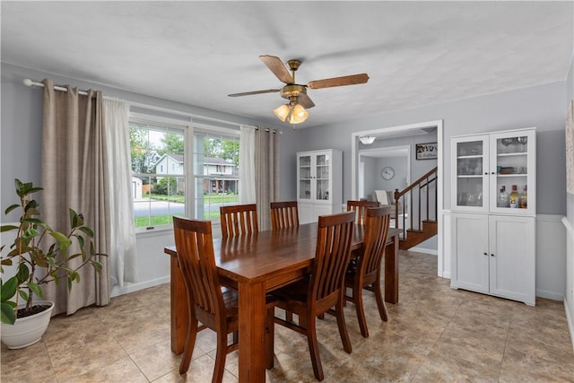 1022 Penguin St, Effingham, IL 62401 - dining space with a ceiling fan, baseboards, light tile patterned flooring, and stairway