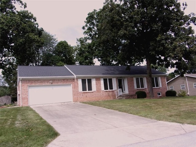 ranch-style home featuring concrete driveway, brick siding, a front lawn, and a garage