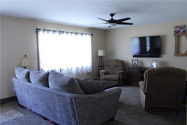 living room with ceiling fan and carpet floors