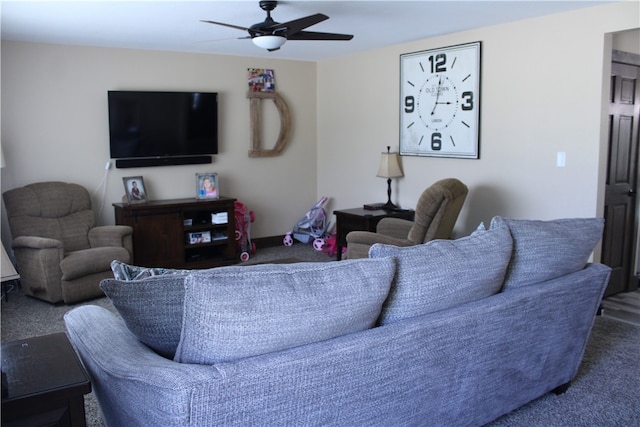 carpeted living room featuring ceiling fan