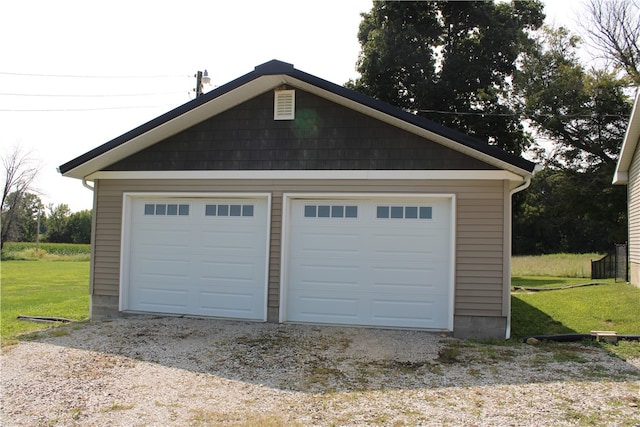 garage with a lawn