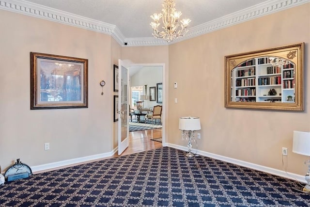 interior space with ornamental molding, a chandelier, and carpet floors