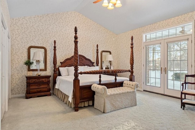 bedroom with light carpet, french doors, access to outside, vaulted ceiling, and ceiling fan