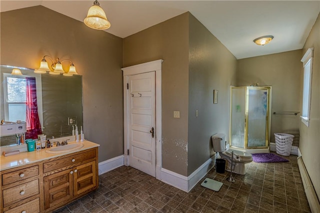 bathroom with vanity, a shower stall, baseboards, and vaulted ceiling