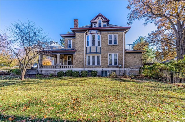 exterior space featuring a front lawn, fence, central AC, and a chimney