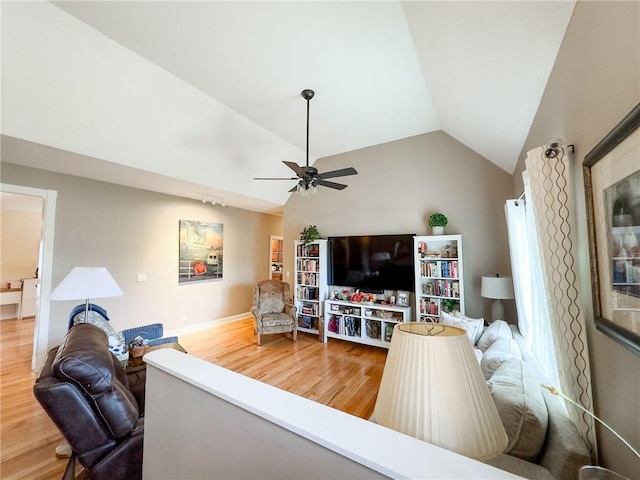 1165 Crooked Ln, Dennison, IL 62423 - living room with baseboards, vaulted ceiling, a ceiling fan, and wood finished floors