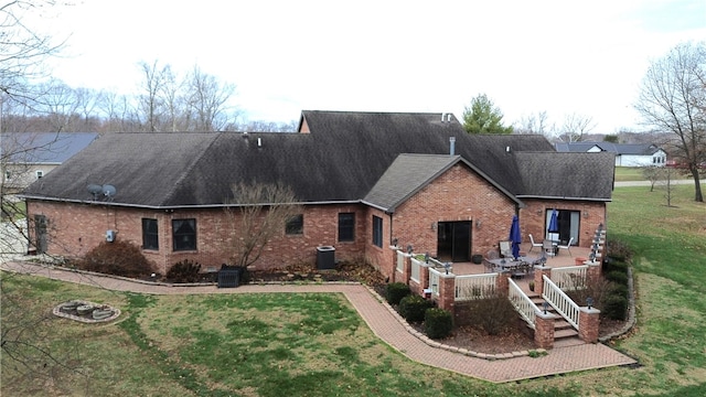 1165 Crooked Ln, Dennison, IL 62423 - rear view of house with cooling unit, a yard, and brick siding