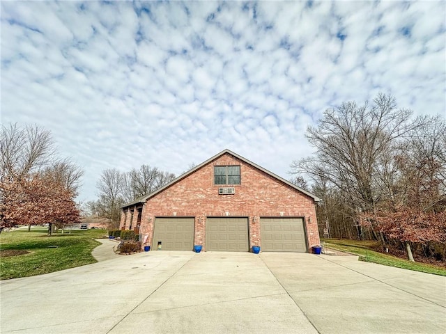 1165 Crooked Ln, Dennison, IL 62423 - view of side of property with concrete driveway, brick siding, and a garage