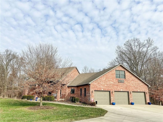 view of front of property with a garage and a front yard