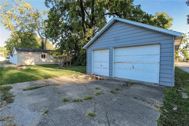 garage featuring a yard